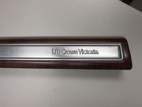 2001 Ford Crown Victoria - This trim piece reads 'LTD Crown Victoria' and appears to be from the interior of a Ford vehicle.