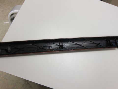 2001 Ford Crown Victoria - This is a close-up view of the interior trim piece, showing its internal structure and attachment points.