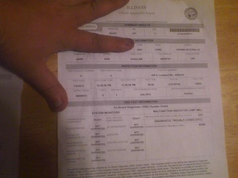 2003 Ford Crown Victoria - This document shows a vehicle inspection report for a 2003 Ford Crown Victoria LX, indicating it passed its emissions test.