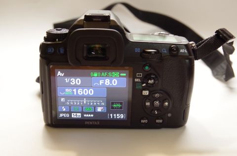1983 Ferrari Enzo - The rear LCD of a Pentax K-7 camera displays shooting settings including aperture, shutter speed, and ISO.