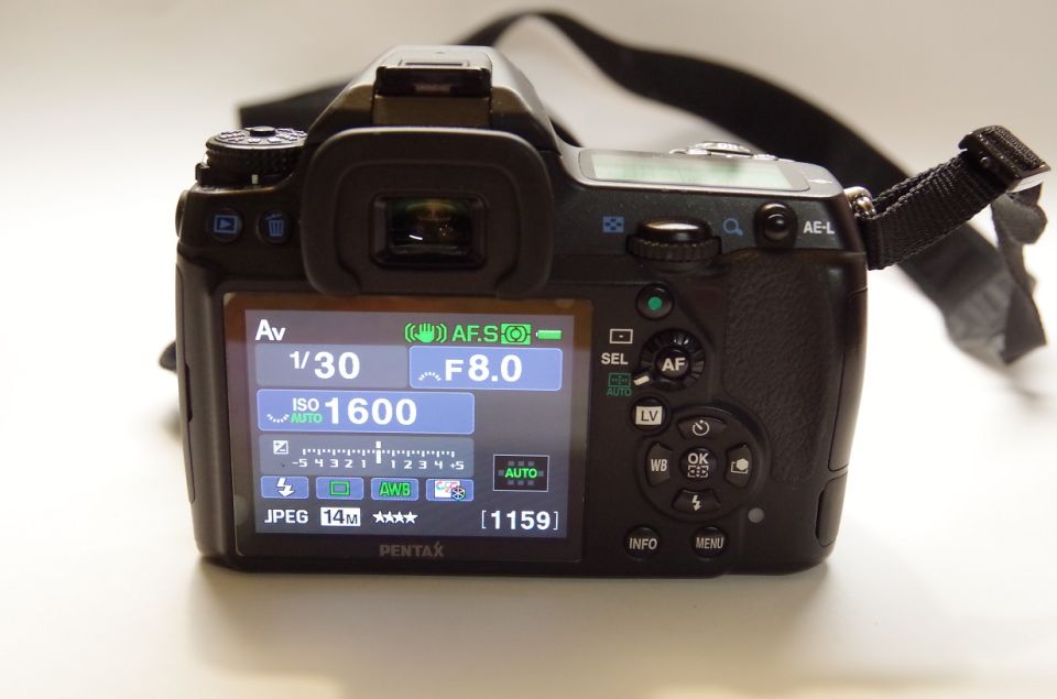 Rear view of a Pentax K-7 camera showing settings on its LCD screen