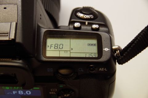 1983 Ferrari Enzo - Close-up of a camera's LCD screen displaying aperture and battery status.
