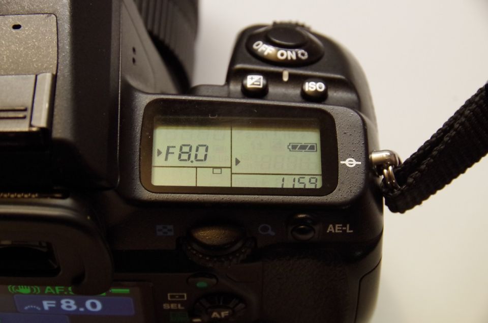 Camera LCD screen showing F8.0 aperture and battery level