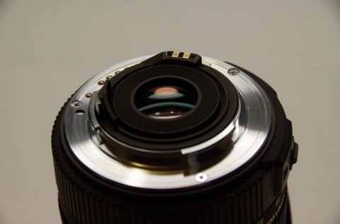 1983 Ferrari Enzo - The rear of a camera lens shows its mount and electrical contacts, not a 1983 Ferrari Enzo.