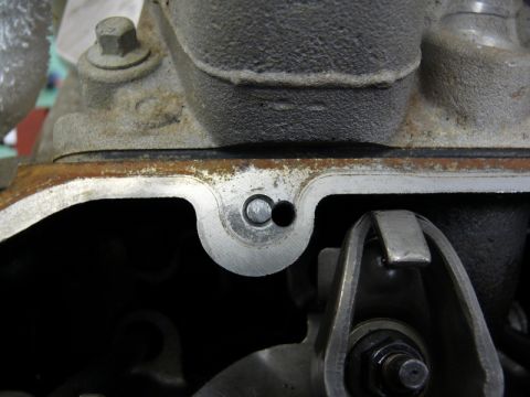 1976 Chevrolet Corvette - A close-up view shows internal engine components, including a rocker arm and valve stem.