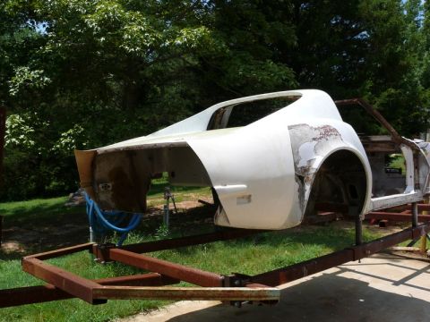 1976 Chevrolet Corvette - This car body, likely a 1975 Corvette, is mounted on a trailer for restoration.