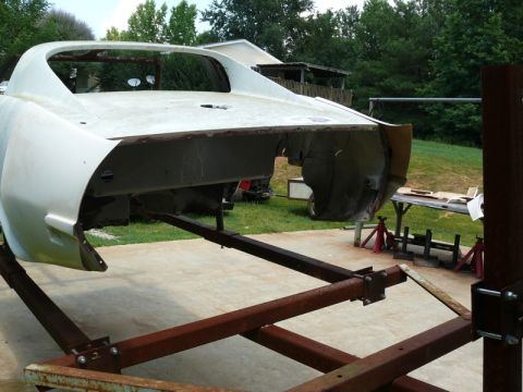 1976 Chevrolet Corvette - The rear body section of a 1976 Chevrolet Corvette is shown on a trailer, undergoing restoration.