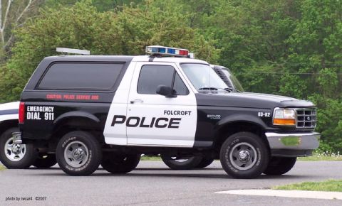 1992 Ford Bronco - This police SUV, marked 'Folcroft Police', is equipped with a light bar and emergency markings.