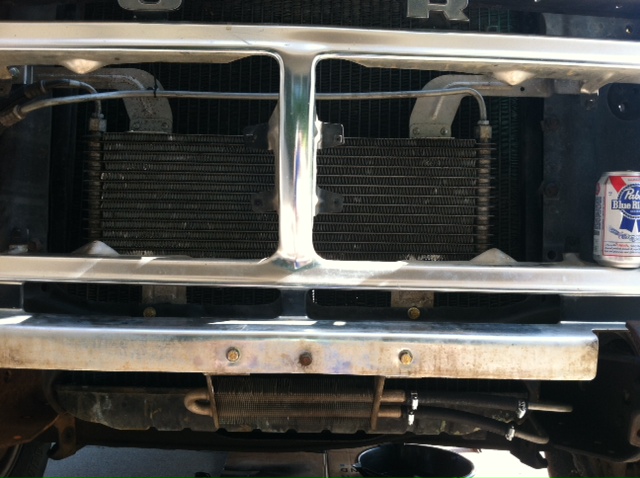 1977 Ford F-350 grille with radiator and a can of Pabst Blue Ribbon