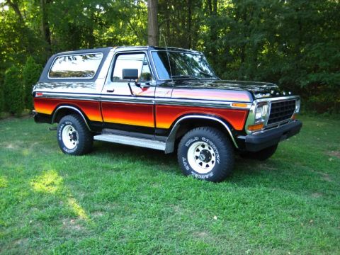 1994 Ford Bronco - This 1978 Ford Bronco features a distinctive sunset-style paint scheme and white-letter tires.