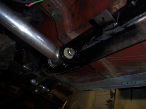 1968 Ford Bronco - Close-up view of the undercarriage, focusing on the crossmember and exhaust system components.