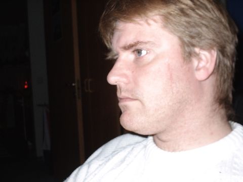 1996 Ford Bronco - Profile view of a man wearing a white sweater.