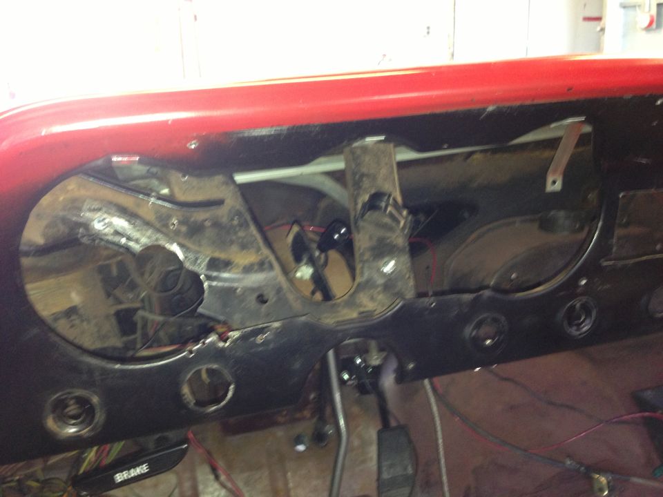 1964 Ford Fairlane dashboard with exposed wiring and missing gauges