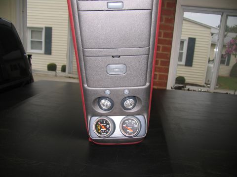 1990 Chevrolet Silverado 1500 - Close-up of a vehicle's center console, gauges and storage compartments.