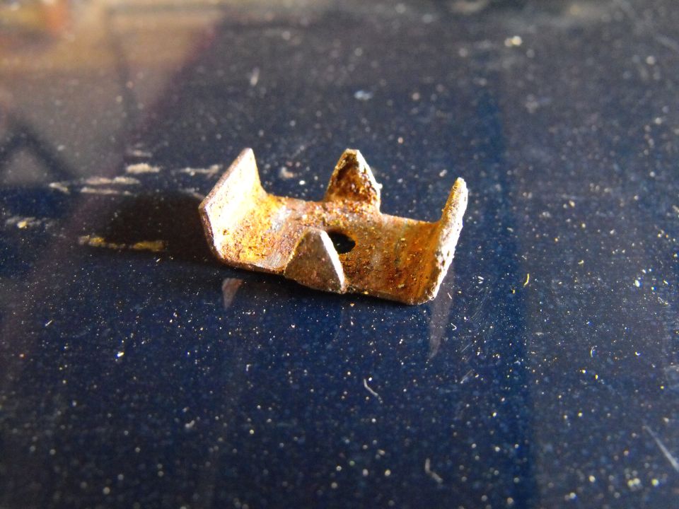 This is the only other stock transmission line clip and it holds both lines as they pass between the motor mouny and the oil pan. The triangles in the middle used to be rectangular. That is all the filing I had to do to get them to accept 3/8 inch lines.