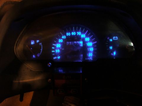 2008 Yamaha Zuma - The illuminated dashboard displays speed, fuel, and battery indicators.