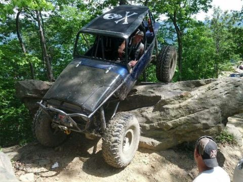 1967 Ford Mustang - This off-road buggy navigates a rocky trail, with another vehicle visible in the background.