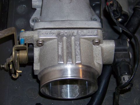 1999 Mercury Grand Marquis - This is a close-up view of a BBK Power-Plus throttle body, showing its part number and size specifications.