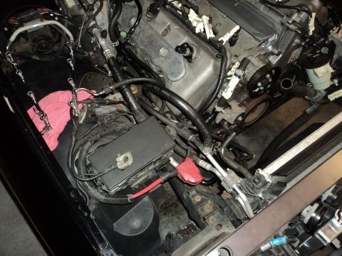 2004 Mercury Grand Marquis - Close-up view of a car's engine bay, with various parts and wiring visible.