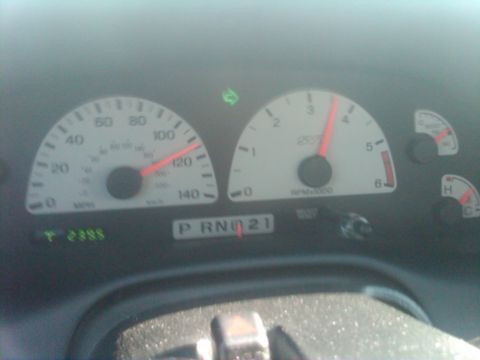 2003 Ford F-150 - Dashboard gauges of a 2003 Ford F-150 Lightning showing speed and RPM.