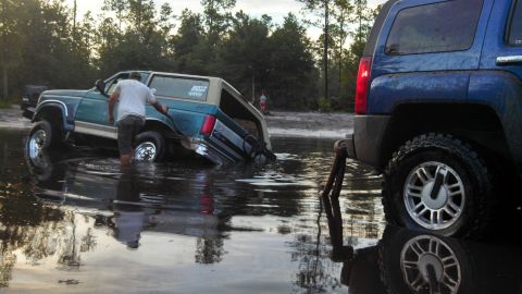 1996 Ford Bronco - Stuck at a place called Plathe. There was a tire hidden under the water I got stock on and dug in.
