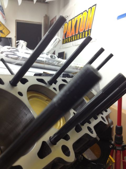 1992 Ford Crown Victoria - Close-up of an engine block with pushrods, with a Paxton Superchargers sign visible in the background.
