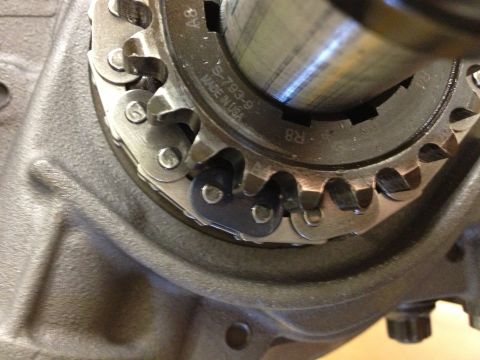 1992 Ford Crown Victoria - Close-up view of an engine's timing chain and sprocket assembly, showing manufacturing details.
