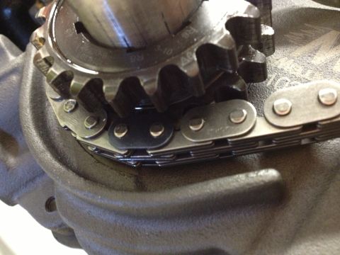 1992 Ford Crown Victoria - Close-up of an engine's timing chain and gear, showing visible markings '3-10 R8 A6'.
