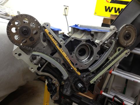 1992 Ford Crown Victoria - Close-up view of an engine's internal timing chain and gear assembly during a rebuild or repair.