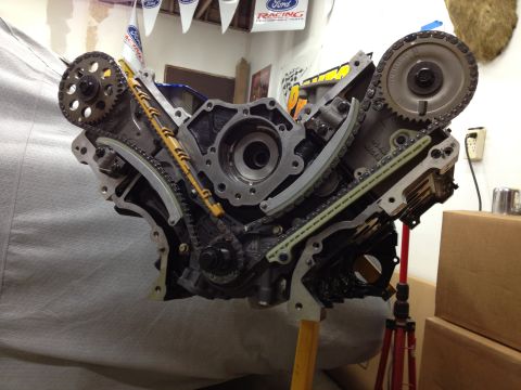 1992 Ford Crown Victoria - Close-up view of a V8 engine block, showing the timing chain and gear assembly.
