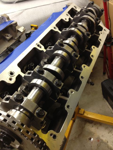 1992 Ford Crown Victoria - Close-up of an engine's cylinder head, showing the camshafts and timing chain mechanism.
