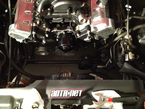 1992 Ford Crown Victoria - Close-up view of a modified engine bay, polished components and a prominent aftermarket logo.