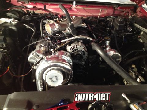 1992 Ford Crown Victoria - Custom engine bay a large turbocharger and performance modifications. The ADTR.net sticker indicates aftermarket parts.