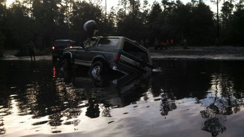 1996 Ford Bronco - Stuck at a place called Plathe. There was a tire hidden under the water I got stock on and dug in.