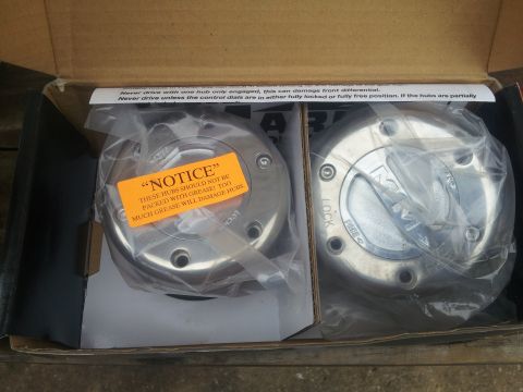 1988 Ford Bronco - New manual locking hubs in box, with installation warning sticker.