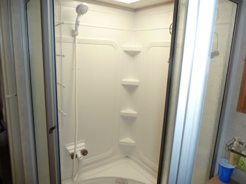 1992 Ford Mustang - Interior view of a shower stall within a recreational vehicle.