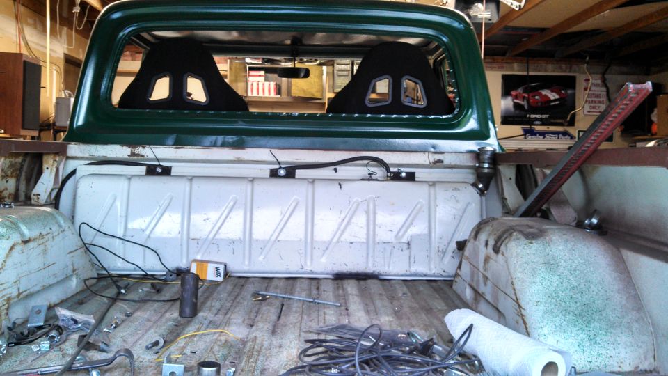 1967 Ford F-250 interior showing racing seats and truck bed contents