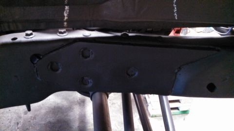 1967 Ford F-250 - Close-up view of a vehicle's undercarriage frame structure.