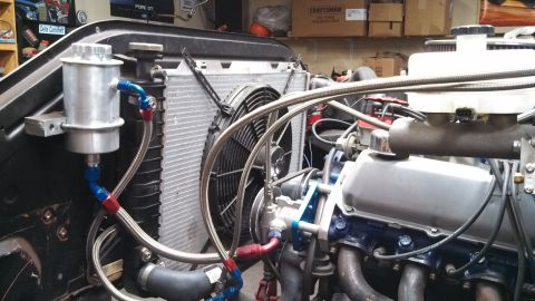 1967 Ford F-250 - Custom engine bay setup with a large radiator and electric fan visible.