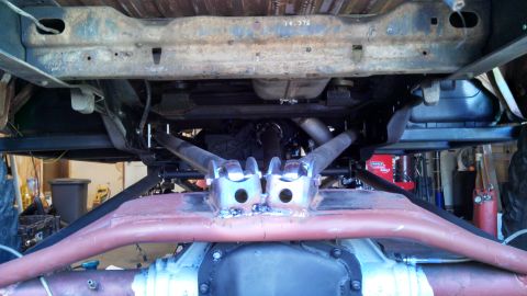 1967 Ford F-250 - Custom suspension components are visible on the underside of a truck, suggesting off-road modifications.