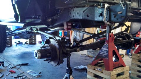 1967 Ford F-250 - Truck chassis undergoing repairs, with suspension and frame components clearly visible.