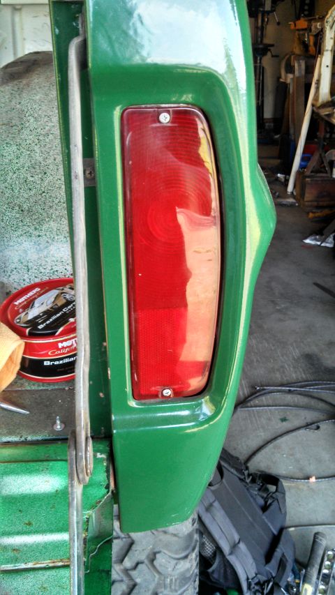1967 Ford F-250 - Close-up of a green truck's rear taillight assembly.