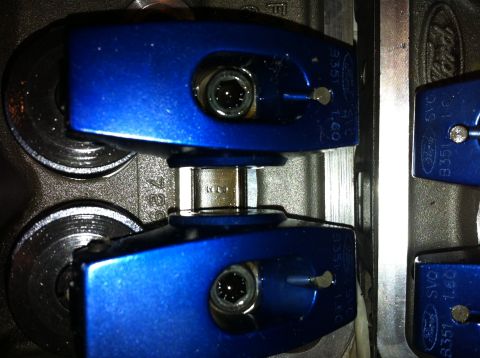 1992 Ford Bronco - Close-up view of blue roller rocker arms, some with Ford B351 markings, installed on an engine block.