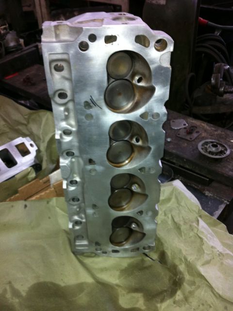 1992 Ford Bronco - Close-up of a clean engine cylinder head, showing the intake and exhaust valves.