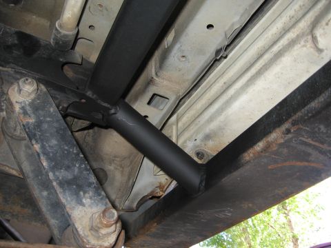 1993 Toyota 4Runner - Close-up view of the undercarriage, revealing custom metalwork and signs of wear.