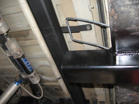 1993 Toyota 4Runner - Close-up of the vehicle's undercarriage, highlighting aftermarket suspension components and bumper supports.