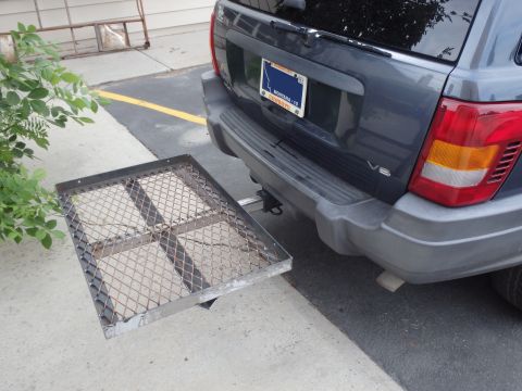 1994 Ford Bronco - A cargo carrier is attached to the rear hitch of a Jeep Grand Cherokee.