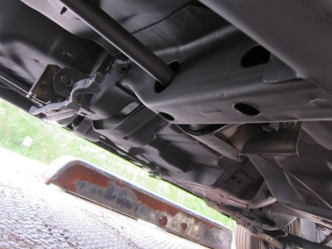 1991 Ford LTD Crown Victoria - A view of the vehicle's undercarriage, focusing on the suspension and frame structure.