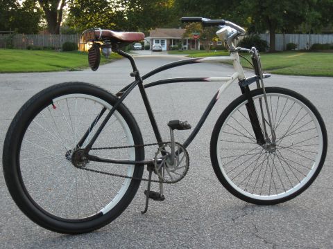 1994 Ford Bronco - A custom bicycle with a unique design is parked on a suburban street.