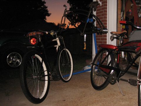 1994 Ford Bronco - Two bicycles and a car are visible in a garage with a sunset in the background.